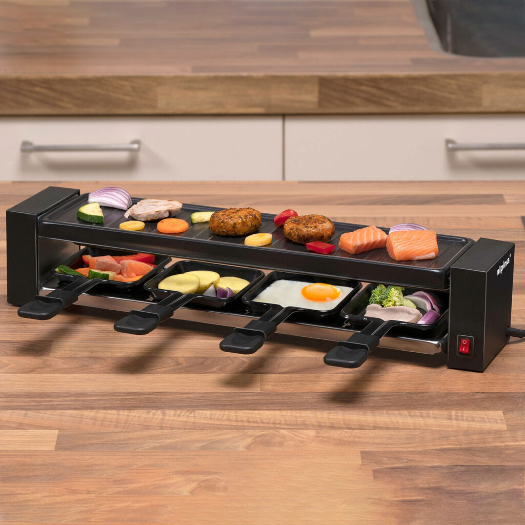 Raclette Grill, bis vier Personen, mit Grillplatte für Gemüse etc, 230 V