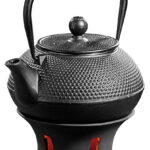 Asiatische Teekanne mit Stövchen aus Gusseisen Asiatische Teekanne mit Stövchen aus Gusseisen