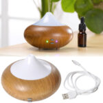 Aroma-Diffusor mit 7 LEDs, Luftbefeuchter in Holz-Optik, braun, weiss, Ø 13 x 10 cm Aroma-Diffusor mit 7 LEDs, Luftbefeuchter in Holz-Optik, braun, weiss, Ø 13 x 10 cm